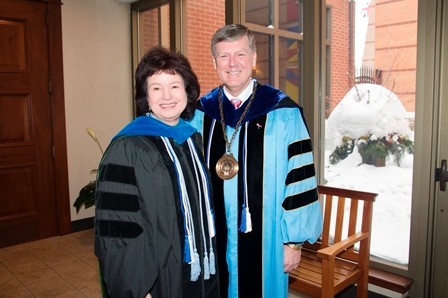 Tom Haas and Gayle Davis pose in their convocation regalia